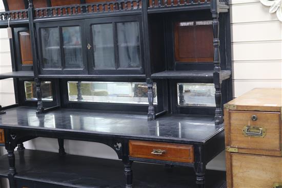 Attributed to Collinson & Lock. A Victorian Aesthetic period ebonised and mahogany chiffonier, W.5ft 6in. D.1ft 10in. H.6ft 8in.